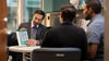 Reproductive endocrinologist Alberuni Zamah, MD, reviews patient ed materials with a couple
